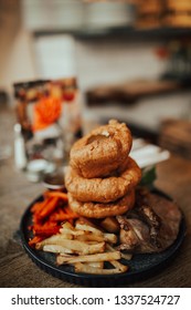 A Close Up Shot Of Traditional British Food, Sunday Roast. Yorkshire Pudding With Roasted Meat And Vegetables. Concept Of Family Lunch, Celebration And Traditional Cuisine.