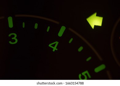 Close Up Shot Of The Turn Signal Icon Displayed On A Car Dashboard.