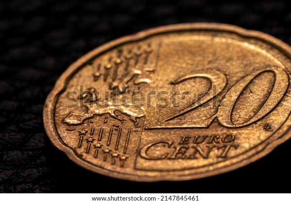 Close up shot of twenty euro cents with map of\
Europe on the coin face