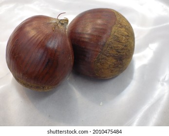 A Close Up Shot Of Two Chestnuts