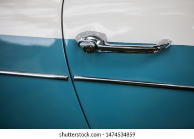 Close Up Shot Of A Vintage Blue Car Door Handle.