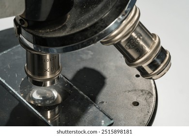 Close up shot of vintage microscope stage with probe glass. Scientific equipment. - Powered by Shutterstock