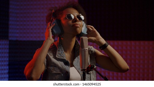 Close Up Shot Of Woman Singing In Recording Booth