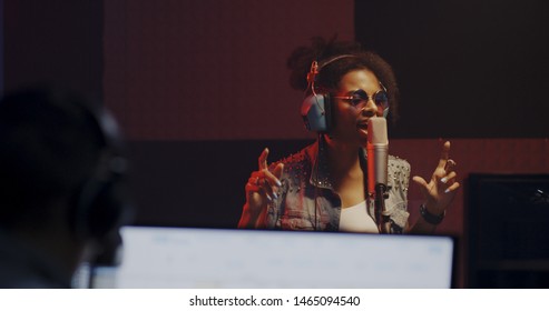 Close Up Shot Of Woman Singing In Recording Booth