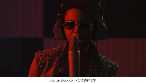 Close Up Shot Of Woman Singing In Recording Booth