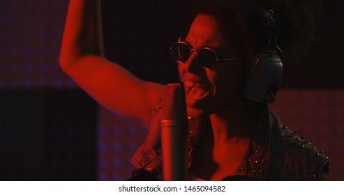 Close Up Shot Of Woman Singing In Recording Booth