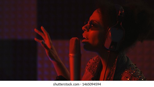 Close Up Shot Of Woman Singing In Recording Booth