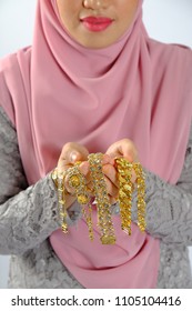 Close Up Shot Of Women Hand Holding Gold Expensiv Jewelry