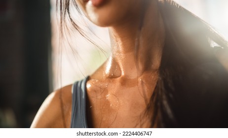 Close Up Shot Of A Young Adult Woman's Neck Sweating After Heavy Workout At Home. Successful Empowered Woman Fighting And Winning Fight Against Injustices, Prejudices.