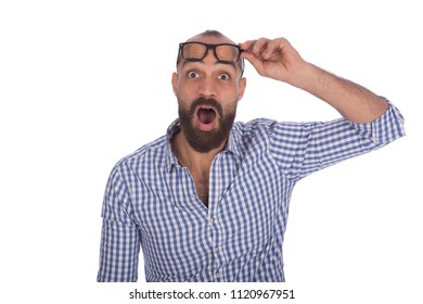 Close shot of a  young man looking very shocked opening his mouth and taking off his eyeglasses, isolated on white background - Powered by Shutterstock