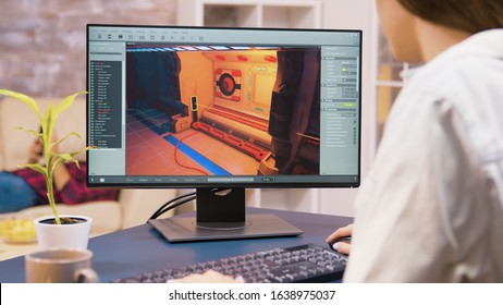 Close Up Shot Of Young Woman Game Developer Working On A New Video Game Level In Her House