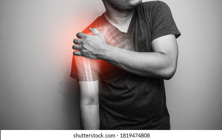 Close Up Shoulder And Clavicle Fracture Pain In A Man, Young Man Holding His Shoulder In Pain  Shoulder  Inflammation Symptoms Medical Healthcare Concept.
