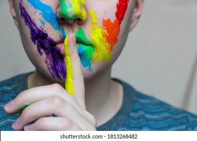 Close Up Of Shushing Lips And Rainbow Face Paint