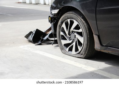 Close up Side The Car wreck in the parking with broken parts and Leaking the tyre. crash big damaged and a broken car. waiting for the insurance claim. accident and safety driving concept.  - Shutterstock ID 2108586197