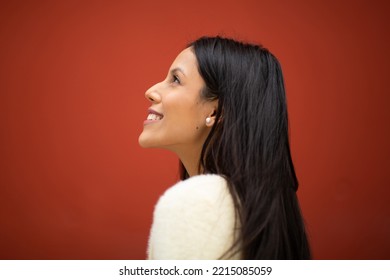 Close Up Side Portrait Happy Young Latin Woman Against Red Background