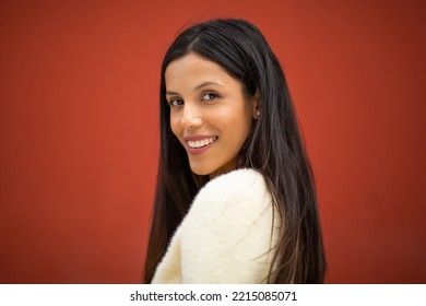 Close Up Side Portrait Smiling Young Woman Against Red Background