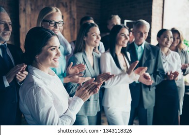 Close up side profile blurry view photo different age members business people stand she her he him his together best brigade show appreciation clap hands arms project power formal wear jackets shirts - Powered by Shutterstock