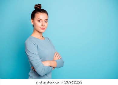 Close up side profile photo cute beautiful amazing she her lady arms crossed stylish hairstyle look wondered self-confident clever smart wear casual sweater pullover isolated blue bright background
