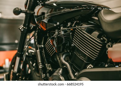 Close up side view of the motorcycle on the lift at the service station. Bike during the repair and oil change. - Powered by Shutterstock