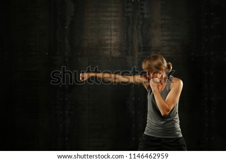 Similar – Image, Stock Photo Close up side view profile portrait of one young middle age athletic woman shadow boxing in sportswear in gym over dark background, looking away