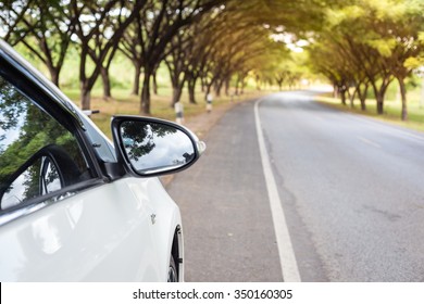 Close Up Sideview Mirror White Cars Beside The Road.