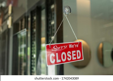 Close up of a sign sorry we're closed - Shutterstock ID 1742043089