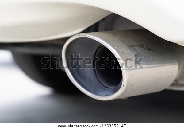 Close\
up of a silver chrome exhaust pipe from people used car every day,\
And selective focus rim silver chrome exhaust\
pipe