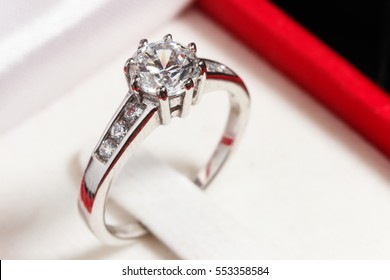 Close Up Silver Diamond Ring In Red Ring Box