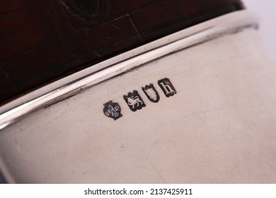 A close up of silver hallmarks