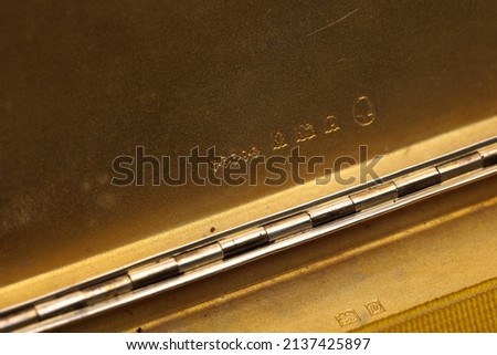 A close up of silver hallmarks