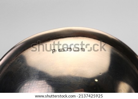 A close up of silver hallmarks