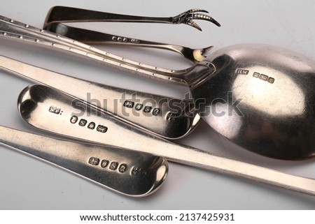 A close up of silver hallmarks