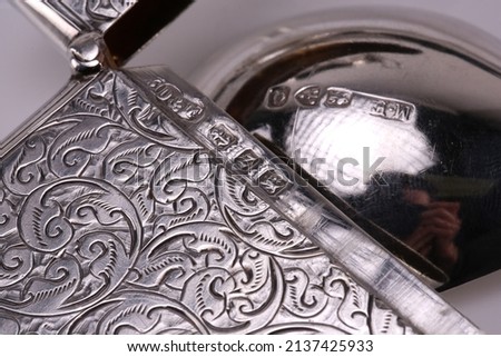 A close up of silver hallmarks