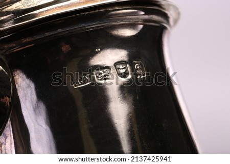 A close up of silver hallmarks