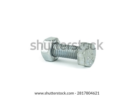 Close up of a silver hex bolt and nut, a durable metal fastener used in construction and engineering projects