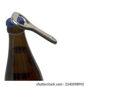 Close up silver retro vintage bottle opener that opens the crown cap of a brown beer bottle on white background