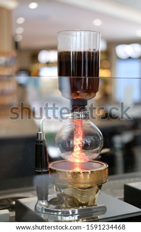 Close up siphon brewing coffee for hot espresso
