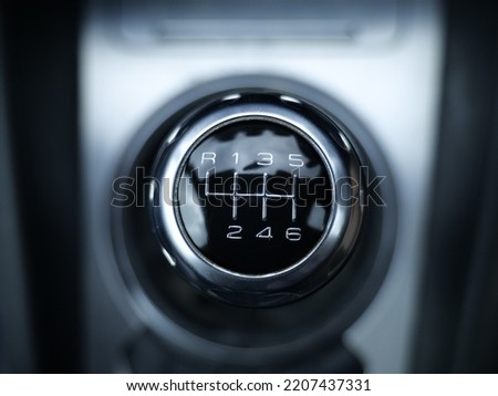 close up of a six speed shift gear stick knob