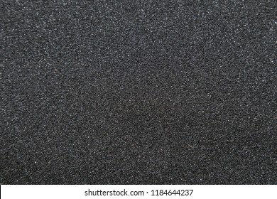 Close up of of skateboard grip tape. Macro photograph of sandpaper texture - Shutterstock ID 1184644237