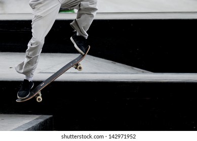 Close up of a skateboarders feet while skating - Powered by Shutterstock