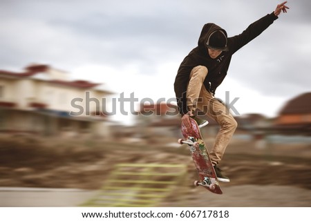 Similar – Image, Stock Photo Skater Performing a Trick on Orange Skate Park Rail