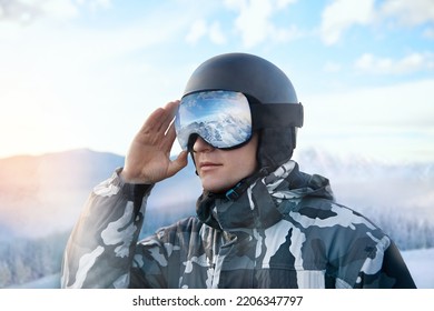 Close Up Of The Ski Goggles Of A Man With The Reflection Of Snowed Mountains. Man On The Background Blue Sky.  Winter Sports - Shutterstock ID 2206347797