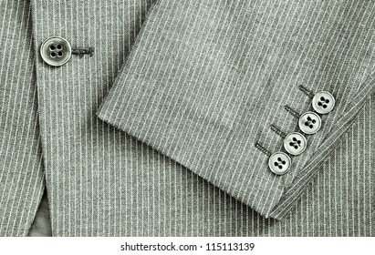 Close Up Of Sleeve And Center Of A Pin Stripe Suit In Black And White