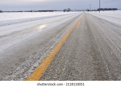 Close Up Of Slippery Icy Slushy Pavement Road In Winter