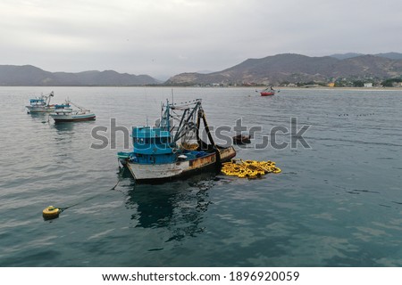  Close up of a small fishing boat with a fishingnet floating alongside