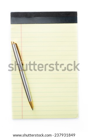 close up of a small note pad and a pen as a reminder concept