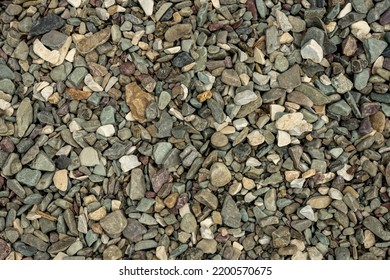 Close Up Of Small Rocks Along St Mary Lake Beach Background Image