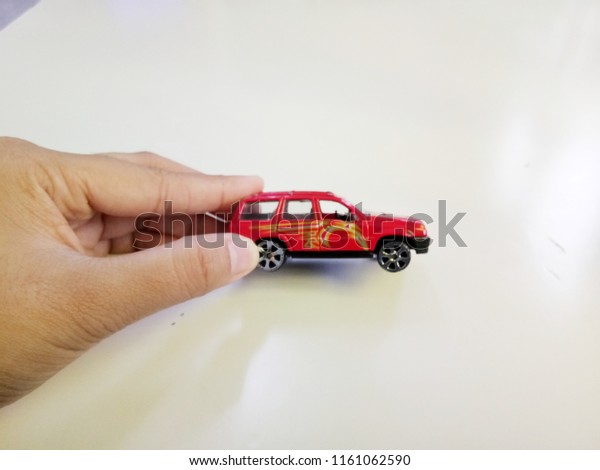 Close up small toy red\
car.