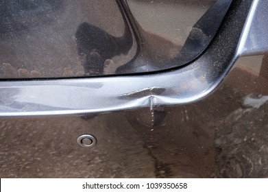 Close Up Small Traces Dent Of Bumper On Gray Car Appear After Crash With Pole