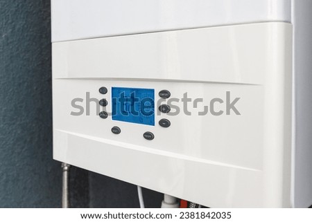 Close up of smart control panel of gas boiler for winter home heating and hot water. Modern house device